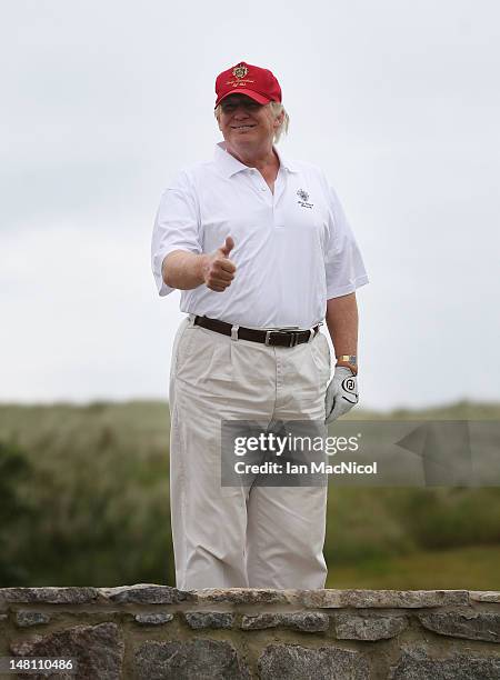Donald Trump plays a round of golf after the opening of The Trump International Golf Links Course on July 10, 2012 in Balmedie, Scotland. The...