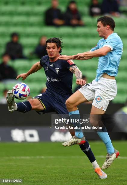 Oskar Zawada of the Phoenix is tackled by Curtis Good of Melbourne City during the round 23 A-League Men's match between Melbourne City and...