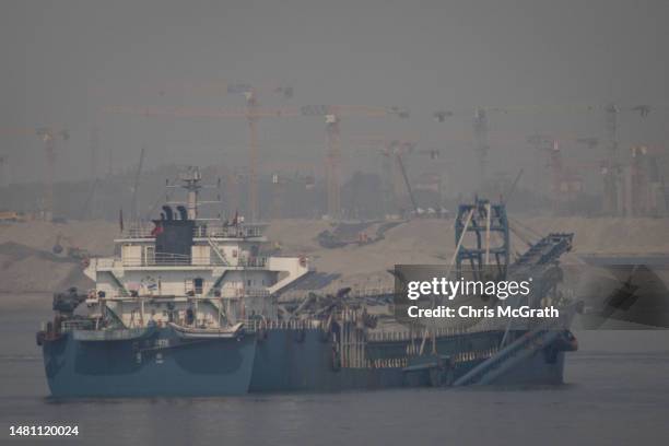 Chinese flagged sand dredge works in the waters between Taiwan and the Chinese city of Xiamen on April 10, 2023 in Kinmen, Taiwan. Kinmen, an island...