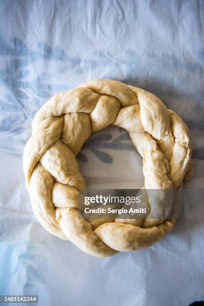 braided raw dough to make italian easter bread (pane di pasqua) - braided bread stock pictures, royalty-free photos & images