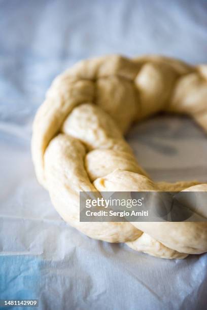 braided raw dough to make italian easter bread (pane di pasqua) - braided bread stock pictures, royalty-free photos & images