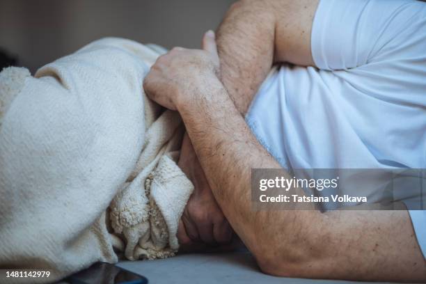 unrecognizable man stomach pain - men stomach pain stock-fotos und bilder