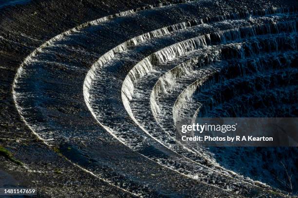 close up of one of the ladybower 'plug holes, peak district, derbyshire, england - stuw stockfoto's en -beelden