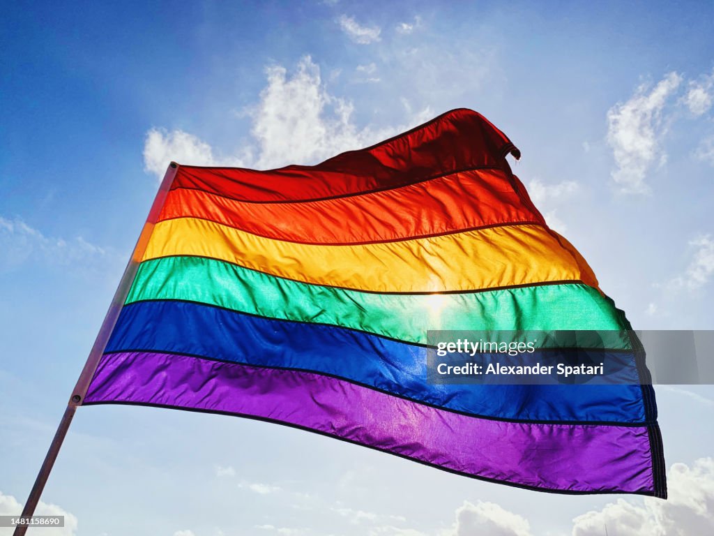 Rainbow LGBTQIA pride flag waving in the wind