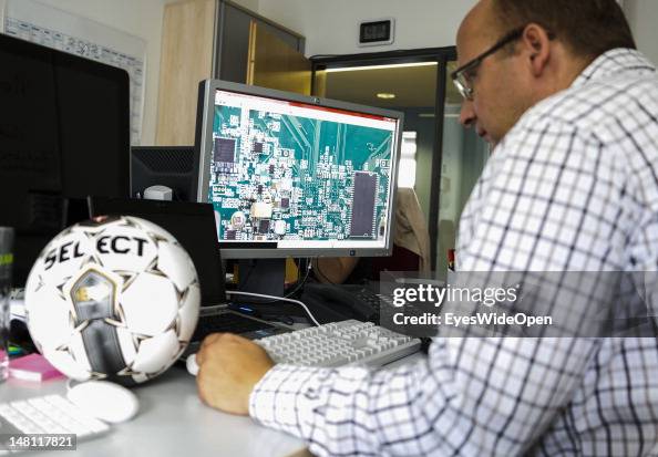 An employee demontrates the GoalRef Technology system on a computer ...
