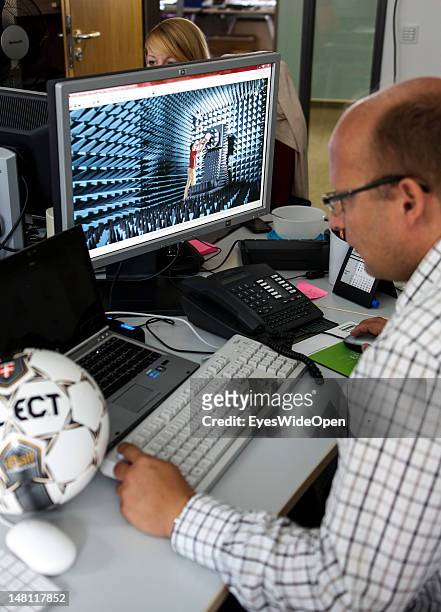 An employee demontrates the GoalRef Technology system on a computer with a magnetic field at Fraunhofer IIS research institute on July 10, 2012 in...