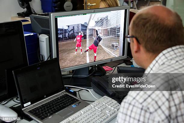 An employee demontrates the GoalRef Technology system on a computer with a magnetic field at Fraunhofer IIS research institute on July 10, 2012 in...