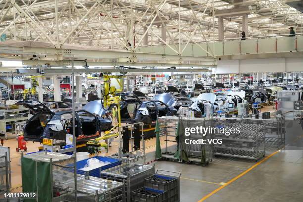 Employees work on the assembly line of Trumpchi GS3 SUV at a workshop of GAC Motor Yichang Plant on March 27, 2023 in Yichang, Hubei Province of...
