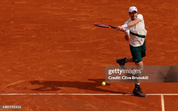 Andy Murray of Great Britain plays a backhand against Alex De Minaur of Australia in their first round match during day two of the Rolex Monte-Carlo...