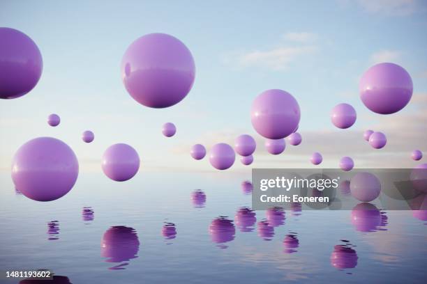 bälle fliegen über dem meer - surrealismus stock-fotos und bilder