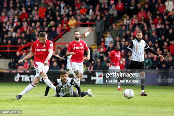 Paul Mullin of Wrexham scores the team's first goal during the Vanarama National League match between Wrexham and Notts County at The Racecourse on...