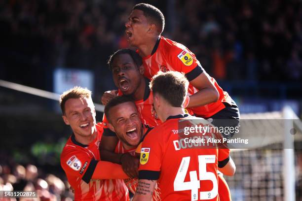 Carlton Morris of Luton Town celebrates after scoring the team's second goal during the Sky Bet Championship between Luton Town and Blackpool at...