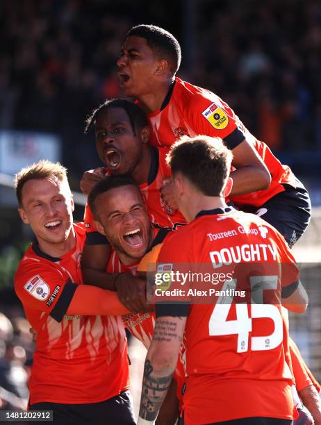 Carlton Morris of Luton Town celebrates after scoring the team's second goal during the Sky Bet Championship between Luton Town and Blackpool at...