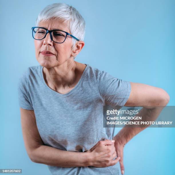 woman in pain - sciatic nerve fotografías e imágenes de stock