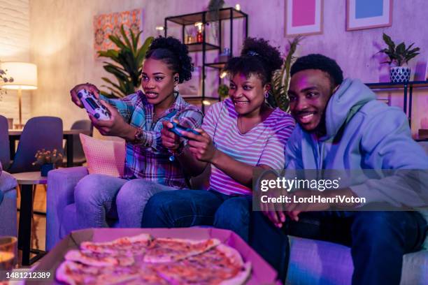 game night with friends - adrenaline junkie stock pictures, royalty-free photos & images