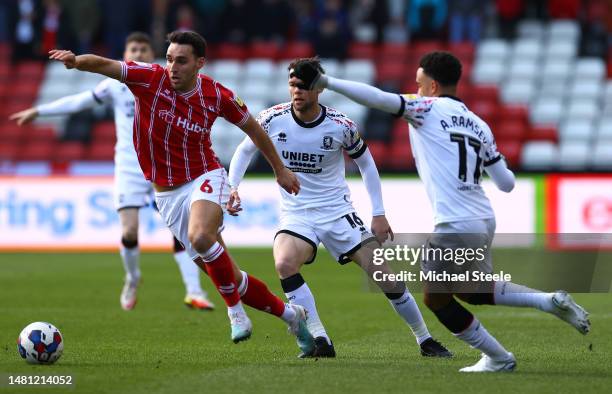 Matty James of Bristol City challenged by Jonathan Howson and Aaron Ramsey of Middlesbrough during the Sky Bet Championship between Bristol City and...