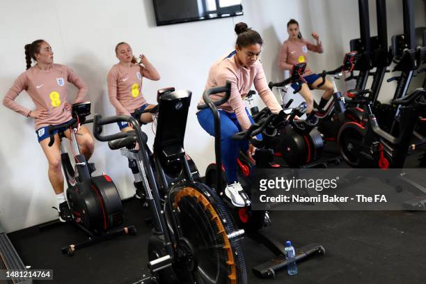 Lucy Parker, Katie Robinson, Jess Carter and Jess Park of England train during an England Gym Session at The Lensbury on April 09, 2023 in...