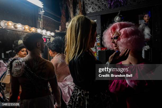 Austin, TX drag queen Cheri Lake who performs under the name 'Brigitte Bandit' prepares to perform at the Elysium nightclub on April 07, 2023 in...