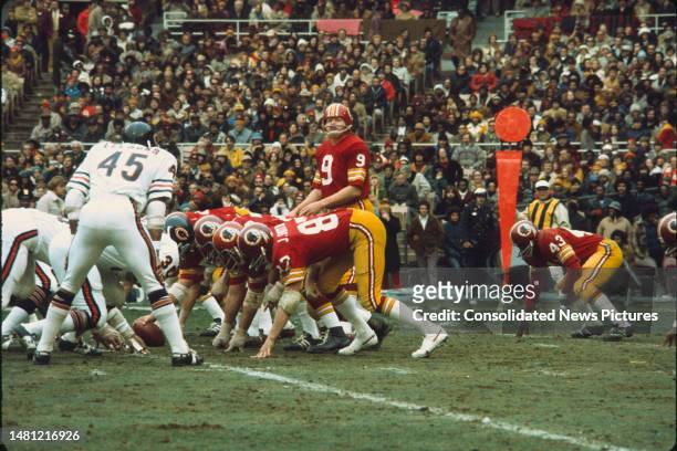 View of members of the Chicago Bears football team line up against members of the Washington Redskins during a game at RFK Stadium, Washington DC,...