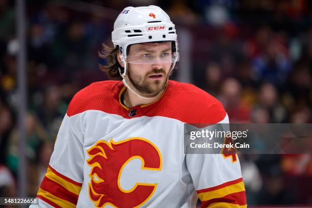 Rasmus Andersson of the Calgary Flames waits for a face-off during the third period of their NHL game against the Vancouver Canucks at Rogers Arena...