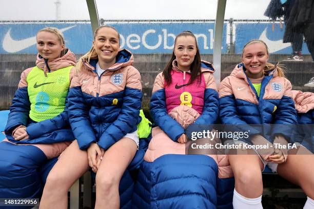 The substitute players of England sit on the bench during the Women's Under 23 International friendly match between Belgium and England at Cegeka...