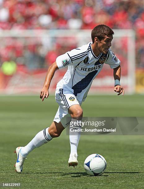 Hector Jimenez of the Los Angeles Galaxy controls the ball against the Chicago Fire during an MLS match at Toyota Park on July 8, 2012 in Bridgeview,...