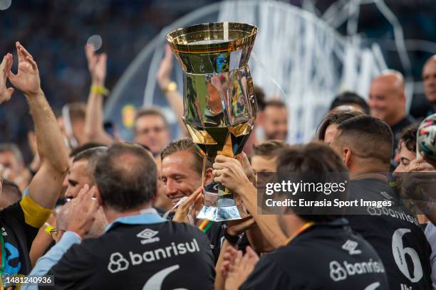 Gremio squad celebrates with the champions trophy after winning Caxias do Sul during Campeonato Gaucho Final match between Gremio and Caxias do Sul...