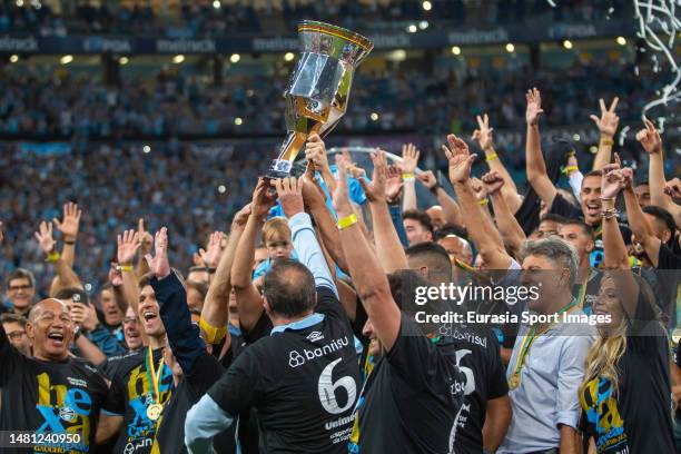 Gremio Head Coach Renato Gaucho celebrates with his players after winning Caxias do Sul during Campeonato Gaucho Final match between Gremio and...