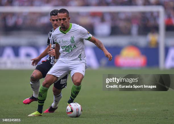 Renzo Saravia of Atletico Mineiro chases Nicolas da Silva of America during Campeonato Mineiro Final match between Atletico Mineiro and America at...