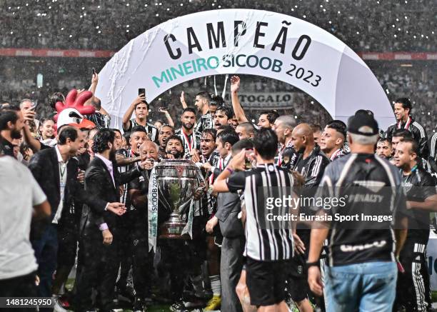 Atletico Mineiro squad celebrates with champions trophy after winning America during Campeonato Mineiro Final match between Atletico Mineiro and...