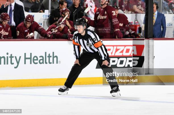 Referee Morgan MacPhee gets ready during a game between the Anaheim Ducks and the Arizona Coyotes at Mullett Arena on April 08, 2023 in Tempe,...