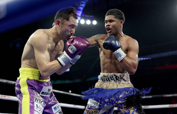 Shuichiro Yoshino of Japan and Shakur Stevenson of the United States exchange punches during their WBC Lightweight Final Eliminator match at...