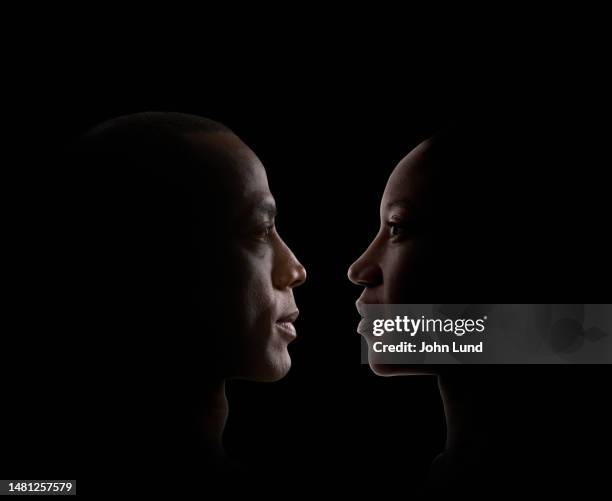contemplative couple - rim light portrait stock pictures, royalty-free photos & images