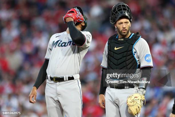 Sandy Alcantara and Jacob Stallings of the Miami Marlins react during the third inning against the Philadelphia Phillies at Citizens Bank Park on...