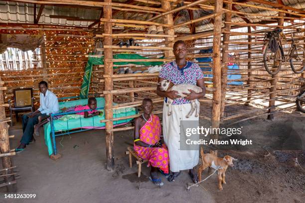 Goat-herder indoors with her family in Juba, South Sudan on April 20, 2014.