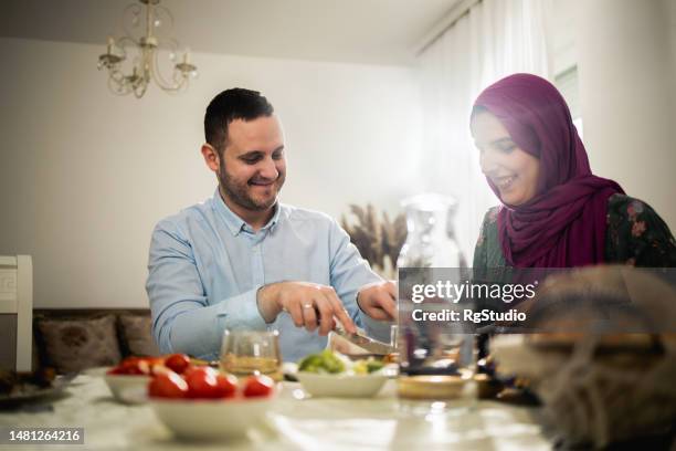 young muslim family spends time together - saudi lunch stock pictures, royalty-free photos & images