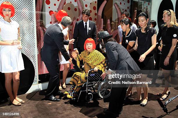 Present Louis Vuitton Chairman and CEO Yves Carcelle, artist Yayoi Kusama and future Louis Vuitton Chairman and CEO Jordi Constans attend the Louis...