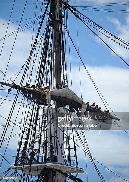 Constitution crew members furl a sail on June 28, 2012.