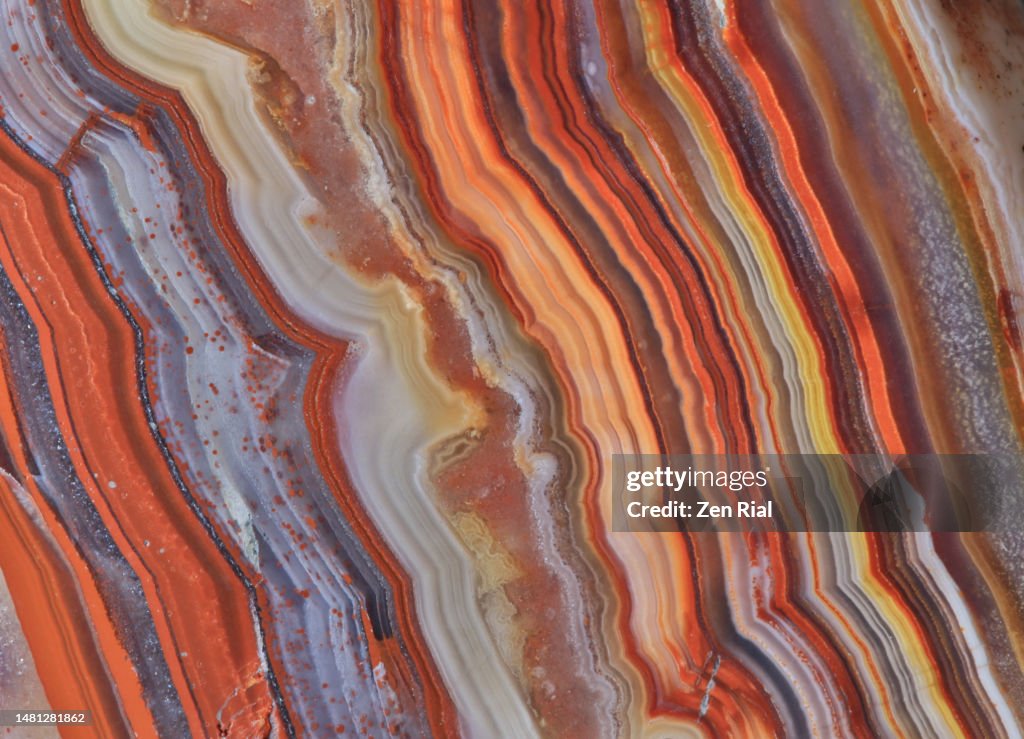 Natural stone banding pattern in agate, close up in full frame