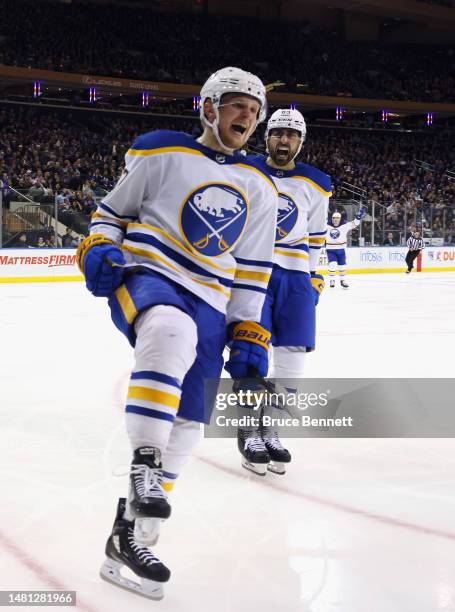 Casey Mittelstadt of the Buffalo Sabres celebrates his third period game-tying goal against the New York Rangers and is joined by Alex Tuch at...