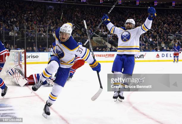 Casey Mittelstadt of the Buffalo Sabres celebrates his third period game-tying goal against the New York Rangers and is joined by Alex Tuch at...