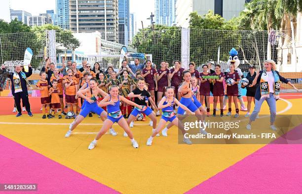 Today Show host Mia Glover is seen dancing with a group of local performers and the Queensland Under 14's State team during a Today Show live cross,...