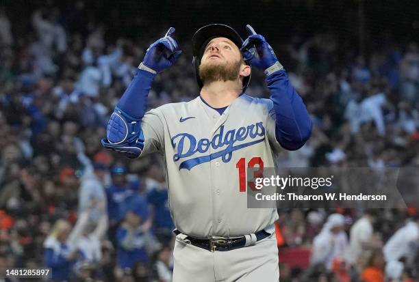 Max Muncy of the Los Angeles Dodgers celebrates after hitting a three-run home run against the San Francisco Giants in the top of the third inning at...