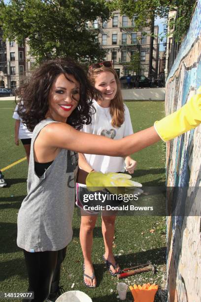 Kat Graham helps restore CITYarts Mosiac Peace Wall during Bing and DoSomething.orgs celebration of The Bing Summer of Doing at Jacob H. Schiff...