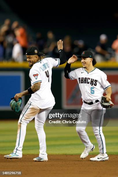 Ketel Marte and Alek Thomas of the Arizona Diamondbacks celebrate after a 3-0 win over the Milwaukee Brewers at Chase Field on April 10, 2023 in...