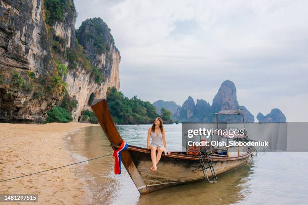 cheerful woman on thai taxi boat - water taxi stock pictures, royalty-free photos & images
