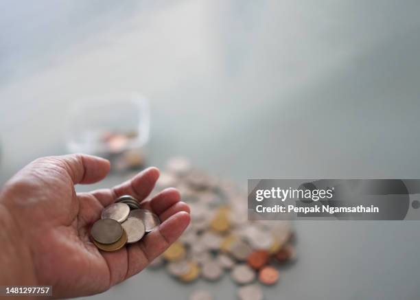 coin on palm - coin in palm of hand stock pictures, royalty-free photos & images