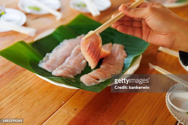 closed up fish raw on the table table - fresh wasabi stockfoto's en -beelden