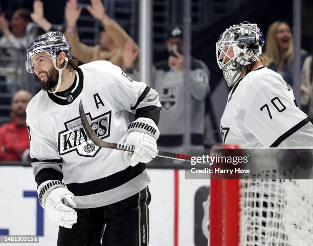 Drew Doughty of the Los Angeles Kings celebrates his empty net goal with Joonas Korpisalo, to take a 3-0 lead over the Vancouver Canucks during the...