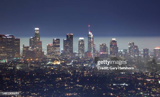 Fog sits on the horizon behind the downtown skyline of Los Angeles as seen from the Griffith Observatory on April 9 in Los Angeles, California.